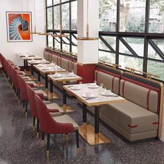 an empty restaurant with long tables and red chairs in front of large windows that look out onto the street