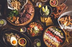 a table topped with lots of different types of food and drinks on top of it