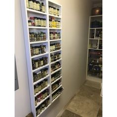 the pantry is stocked with many different types of spices and condiments for sale