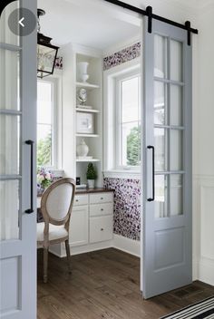 an open door leading to a dining room