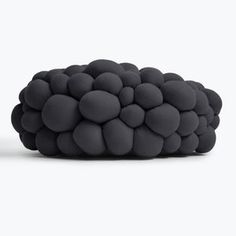 a large black object sitting on top of a white surface