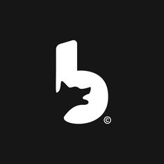 the letter b with a cat's head sticking out of it on a black background