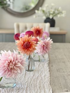 Dahlias in bud vase Dahlia Centerpiece Wedding Simple, Small Dahlia Arrangement, Dahlias In Bud Vases, Dahlia Table Decorations, Dahlia Bud Vases, Bud Vases Wedding Centerpiece Circle Table, Dahlia Bud Vase, Orange Bud Vases