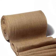 a roll of tan fabric sitting on top of a white surface