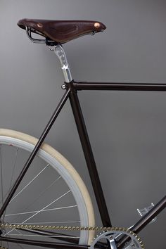 a close up of a bike on a gray background