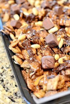 a tray filled with chocolate and nuts on top of a counter