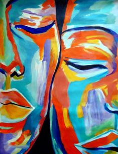 two buddha faces painted in bright colors