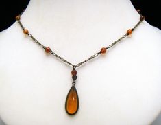 Beautiful Vintage Italian Sterling Amber Necklace Marks - Italy 925 INV on the Clasp, 925 RL (Provence Mark) on the Back of the Tear Drop. Tear Drop Measures 1" Long and 11/2" Wide. Necklace Measures 18" Long with a Spring Ring Clasp. Condition is Very Good with No Flaws and Some Patina. Victorian Drop Jewelry Gift, Vintage Drop Necklaces For Gifts, Vintage Drop Necklaces For Gift, Brown Vintage Charm Jewelry As Gift, Brown Victorian Jewelry Gift, Elegant Brown Soldered Jewelry, Amber Drop Gemstone Necklace, Amber Jewelry Vintage, Victorian Brown Necklace For Gift