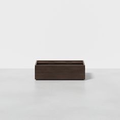 a wooden box sitting on top of a table