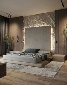 a large bed sitting in the middle of a bedroom next to a wooden floor and wall