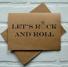 two brown cards that say let's rock and roll on top of each other