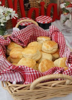 a basket full of biscuits sitting on top of a table