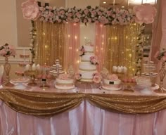 a table topped with lots of cakes and desserts covered in gold sequins