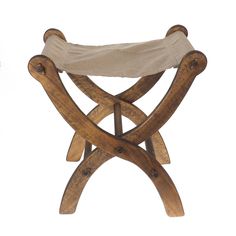 a wooden bench with a canvas seat cover on it's back and legs, against a white background