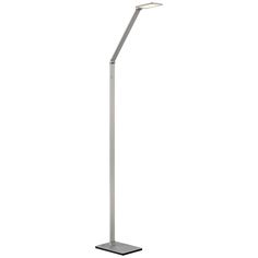 a lamp that is on top of a metal stand with a white light behind it