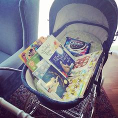 a shopping cart filled with books on top of a rug