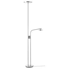 a white floor lamp that is next to a pole