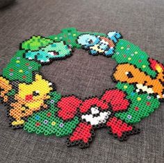 the bracelet is made out of beads and has pokemon characters on it's side