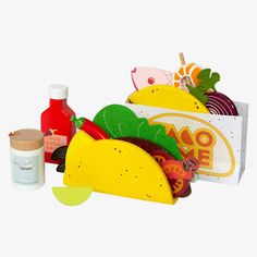 an assortment of tacos and condiments on a white background