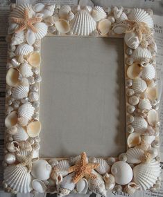 a frame made out of seashells and starfish