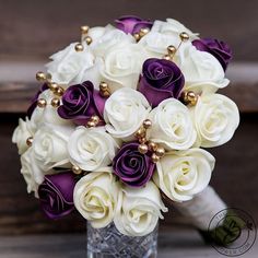 a bridal bouquet with purple and white flowers