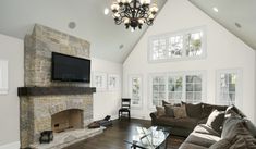 a large living room with gray walls and white trim on the ceiling is shown in this image