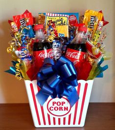 a popcorn box filled with candy and candies