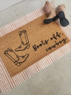 a pair of shoes sitting on top of a door mat that says, best of sandy