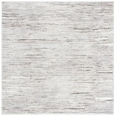 an area rug with white and grey stripes on the top, in front of a white background