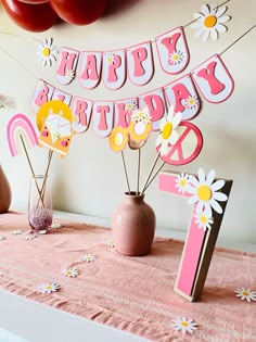 a table topped with pink and yellow decorations