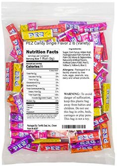 a bag of candy filled with lots of different flavored candies on top of each other