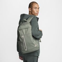 Sleek, modern and made from durable polyester, the Nike Elemental Backpack is a storage staple. Its large zippered compartment comfortably fits shoes or gym clothes along with your books and laptop for school. Two exterior pockets help keep your small essentials organized and accessible. Modern Nylon Sports Backpack, Functional Softback Sports Backpack, Nike Functional Backpack For Outdoor Activities, Nike Practical Backpack For Outdoor Activities, Practical Nike Backpack For Outdoor Activities, Green Nylon Urban Backpack, Modern Sports Backpack, Urban Green Nylon Backpack, Nike Practical Backpack For Everyday Use