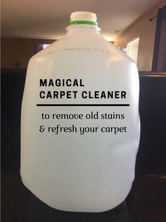 a gallon of carpet cleaner sitting on top of a counter next to a black counter