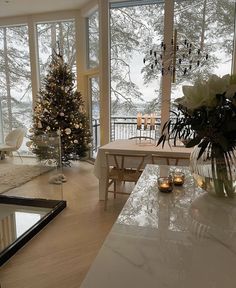 a living room filled with furniture and a large window covered in frosted glass doors