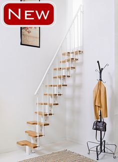 there is a coat rack on the wall next to some stairs with an umbrella hanging from it