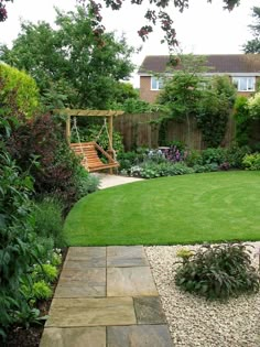 a garden with green grass and small bushes