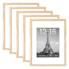 four wooden frames with the eiffel tower in black and white, each holding a photo