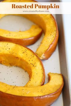 roasted pumpkins in a baking pan with seasoning on them and the words roasted pumpkin