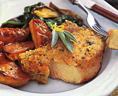 a white plate topped with meat and vegetables