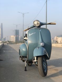 a scooter is parked on the side of the road