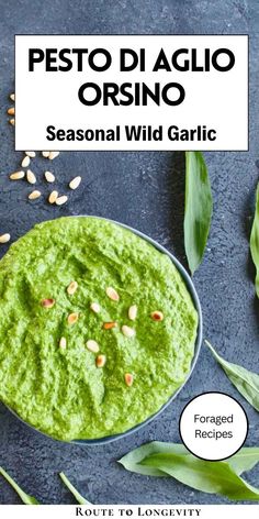 pesto di aglio orsino in a bowl on a table with green leaves