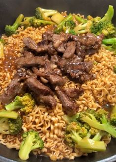 beef and noodles with broccoli in a skillet