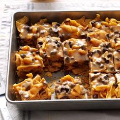 a baking pan filled with baked goods on top of a table