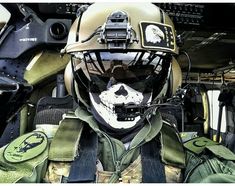 an army pilot with his face painted like a skull