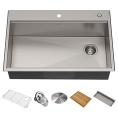 stainless steel kitchen sink with accessories including strainer, grate and cutting board on white background