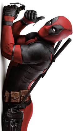 the deadpool character is holding two knives