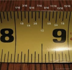 a measuring tape with the number nine on it's side, and an 8 - 9