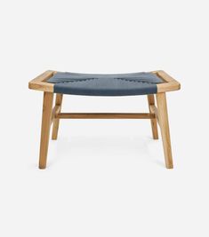 a wooden bench with blue upholstered seat