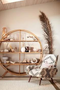 a round shelf filled with vases and other items