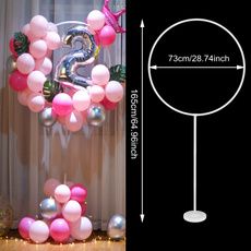 the balloon arch is decorated with pink, white and silver balloons that spell out the number 2